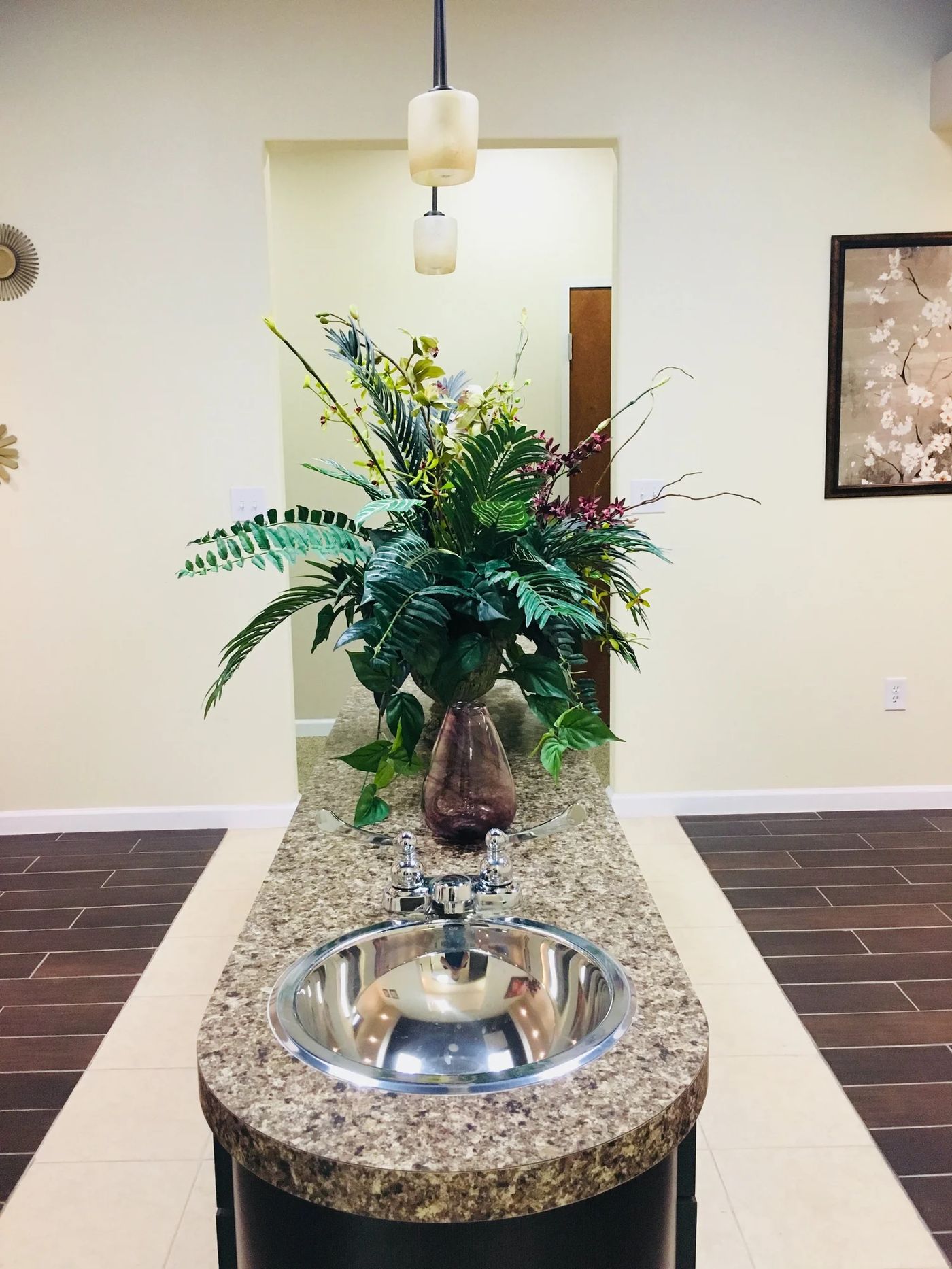 The granite rinse sink at Story Dental with a large floral arrangement