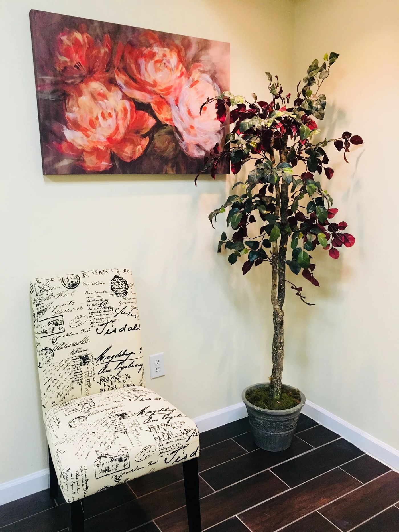 A quiet corner of the Story Dental waiting room with a floral painting